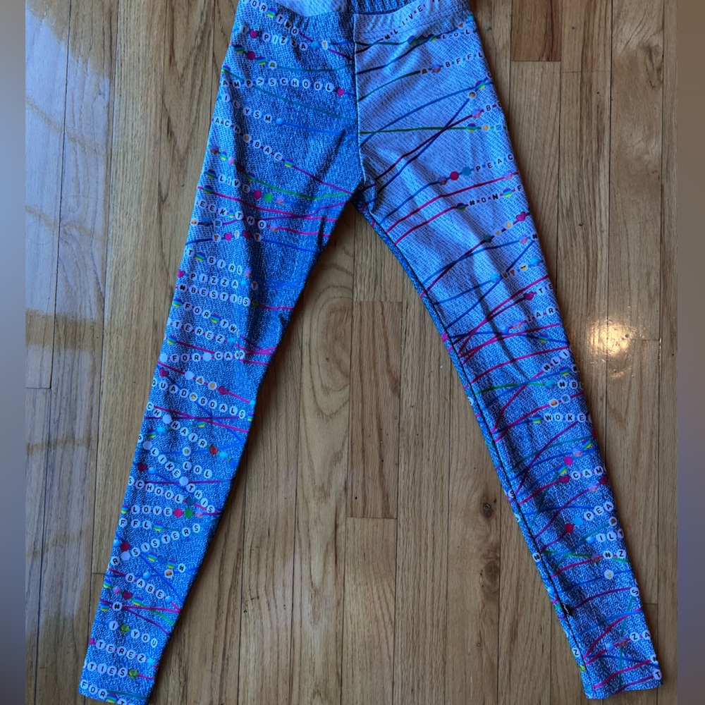 Girl terez leggings! Worn only once. Has friendship bracelets on the pant.